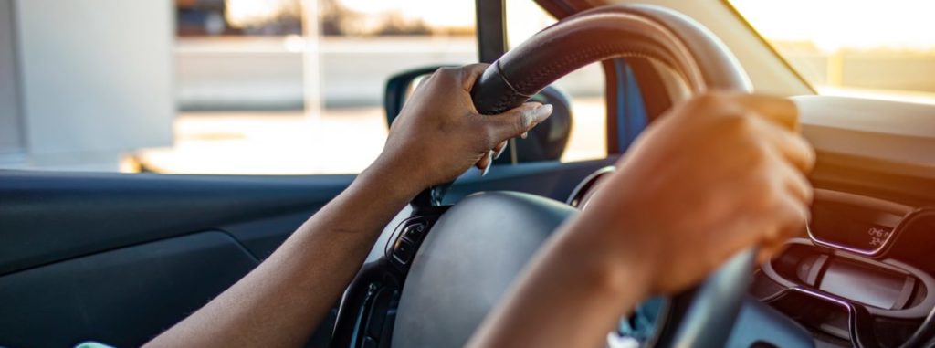 holding steering wheel