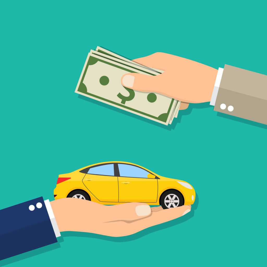 Hand of businessman with money buying a car.